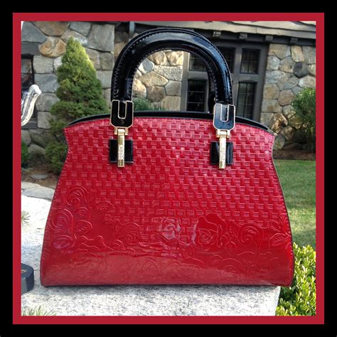 red faux patent leather handbag.